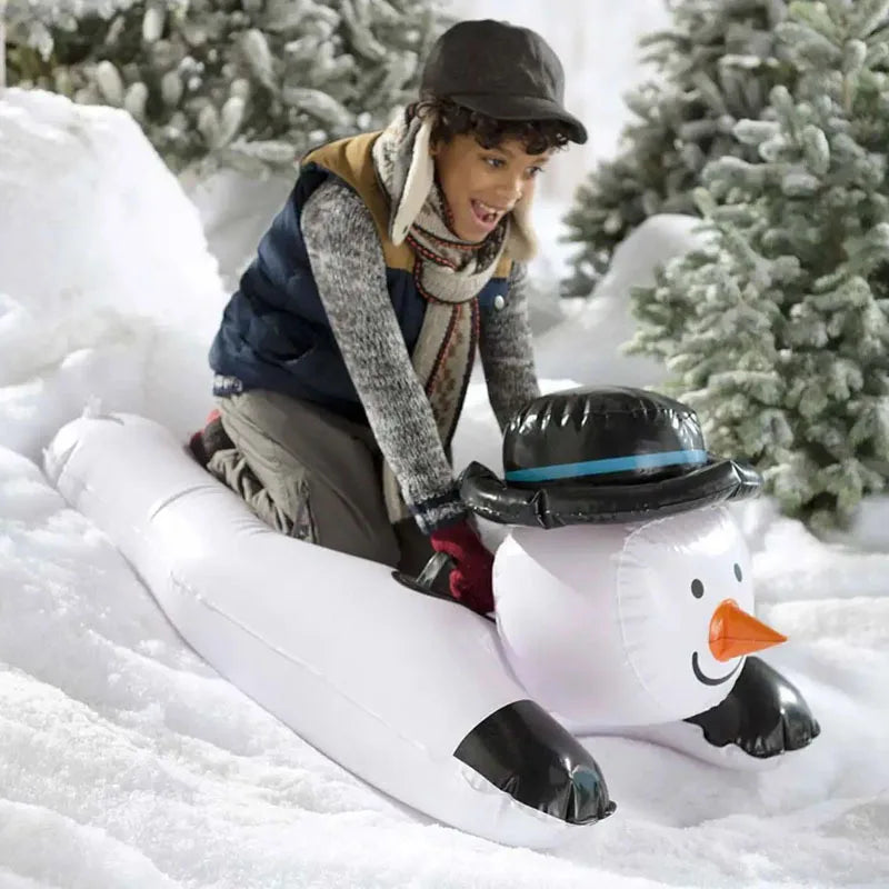 Riding the snowman sled in the snow